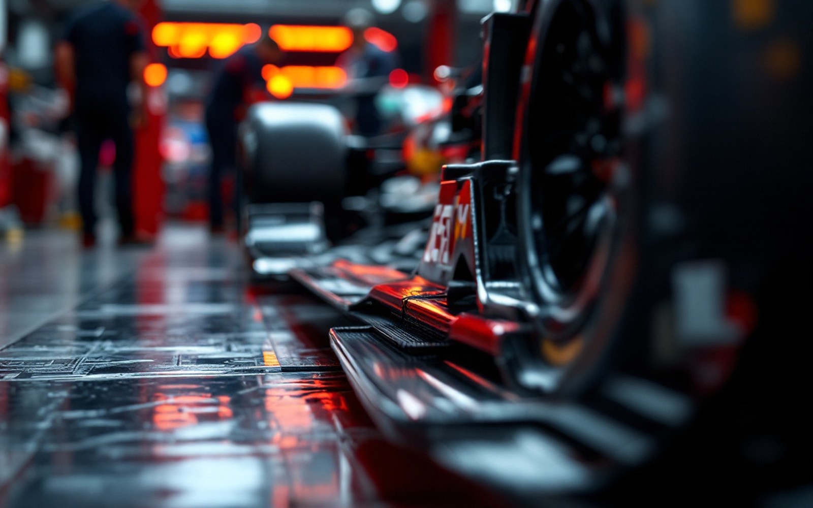 Close on the sliding skirt running along the lower edge of a racing car's sidepod, the car on stands in a garage